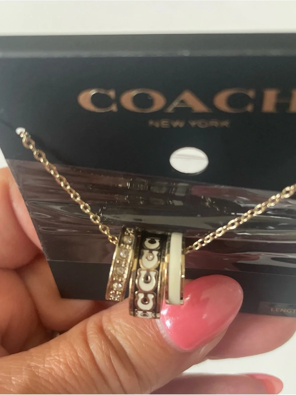 Coach Gold-Tone Necklace with White Enamel and Crystal-Accented Rings